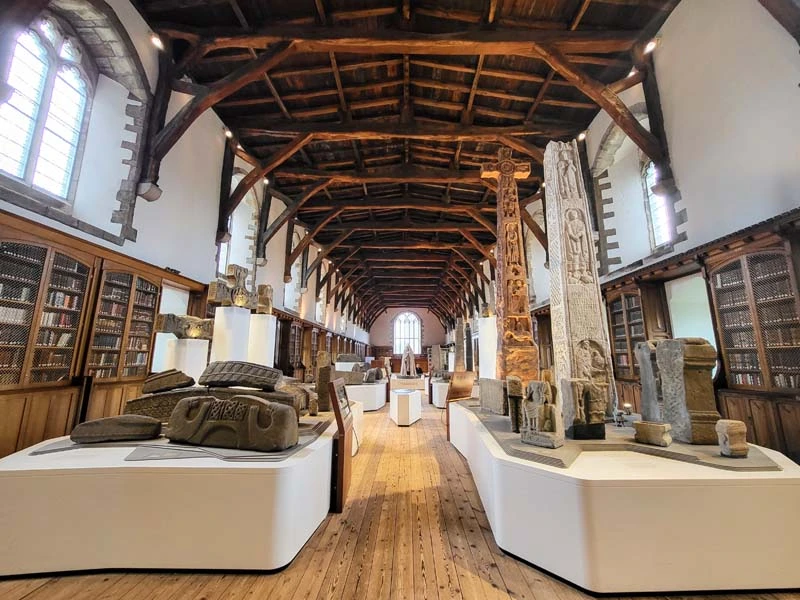 Wide angle photo showing wooden timber roof. Archaeology ruins in the lower half of image. Just one of many things to do in Durham for couples