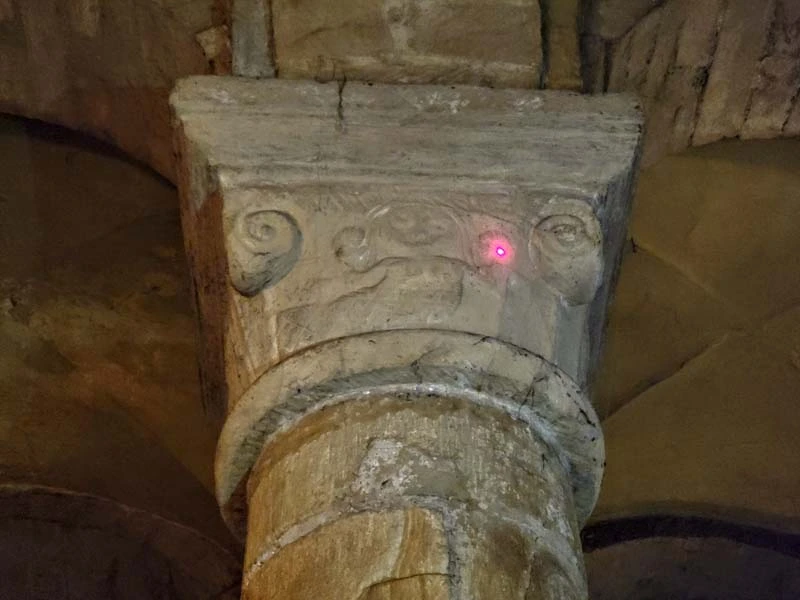 Stone pillar with carved image on the capital. Just one of many things to do in Durham for couples