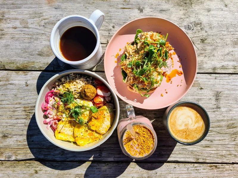 Flat lay image of brunch items against a wooden table