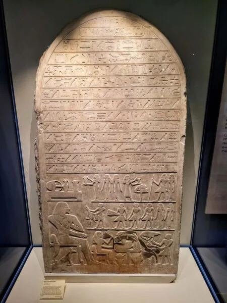 Large stone tablet fills the display case. It contains many lines of clearly visible hieroglyphics. 