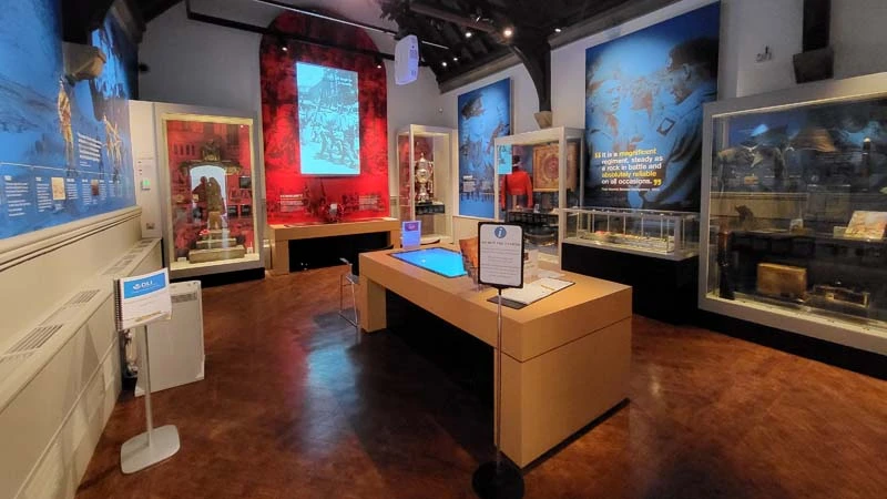 Wide angle of interior of DLI Collection Gallery. Table in centre of image. 