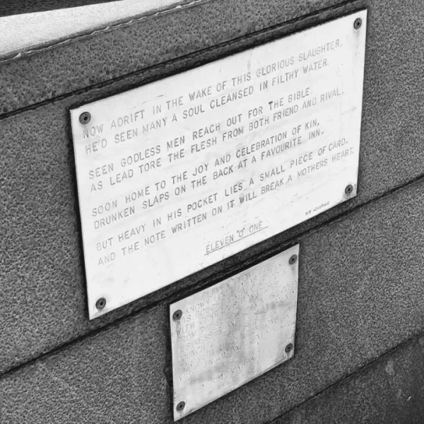 Black and white image of poem on back of "Tommy" sculpture